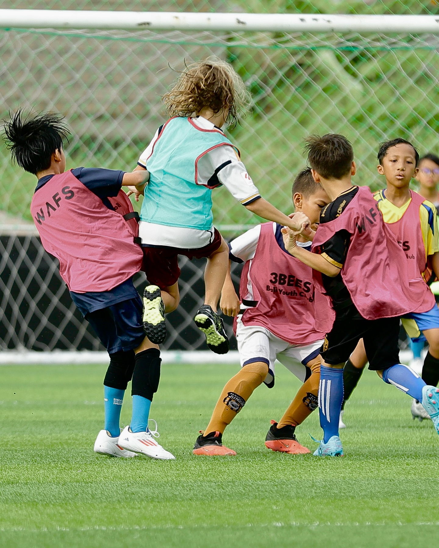 UNITY Football Bali players competing for the ball
